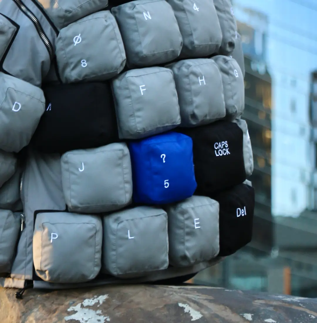 Cobalt key on the quilted keyboard jacket.